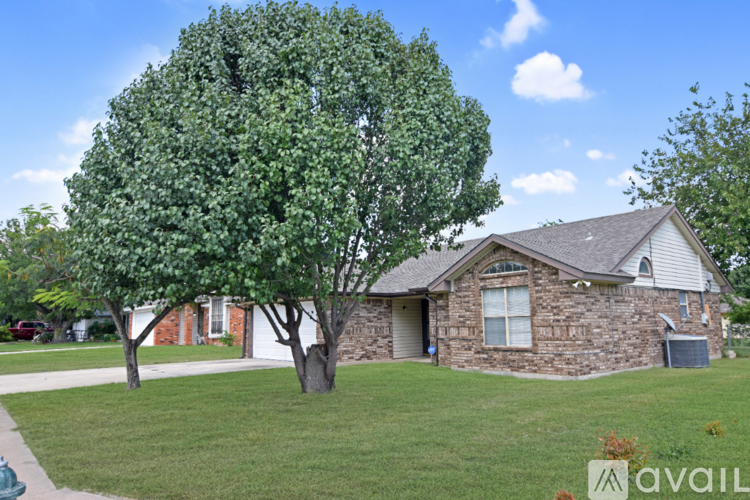 A house with a tree in front of it.