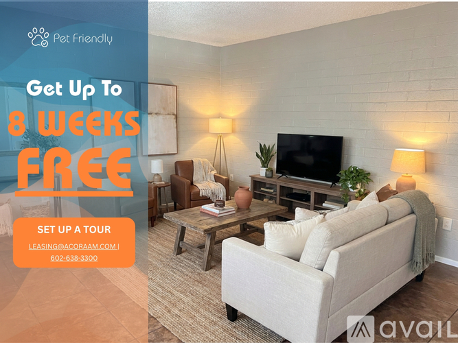 A kitchen with a refrigerator, sink, and cabinets is on display with an advertisement for a free first month of rent.