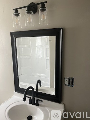 A bathroom sink with a mirror above it.