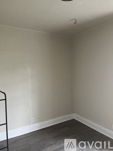 A room with a Avail logo on the floor.