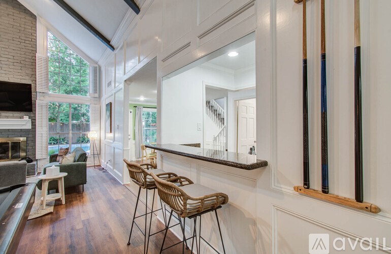A living room with a fireplace and a mirror on the wall.