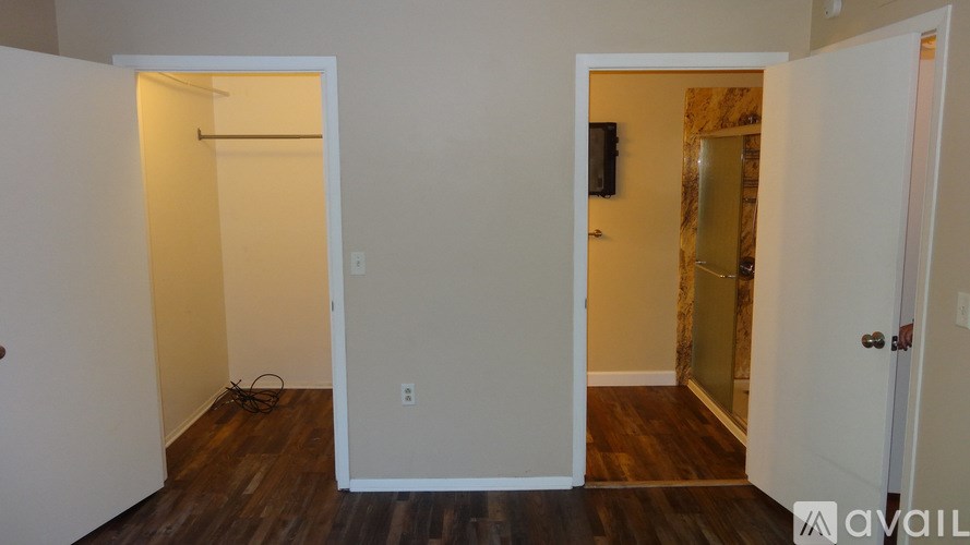 A bathroom with a sink, toilet, and shower.