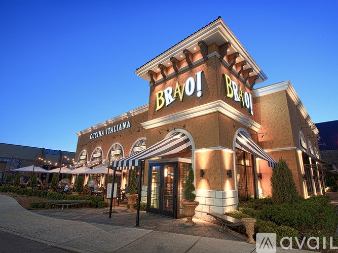 The exterior of a Bravo! Cafe Italiana restaurant at dusk.