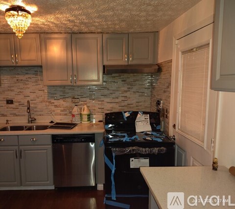 A kitchen with a stove and a dishwasher.