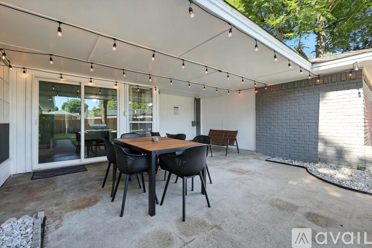 A patio with a table and chairs is available for rent.