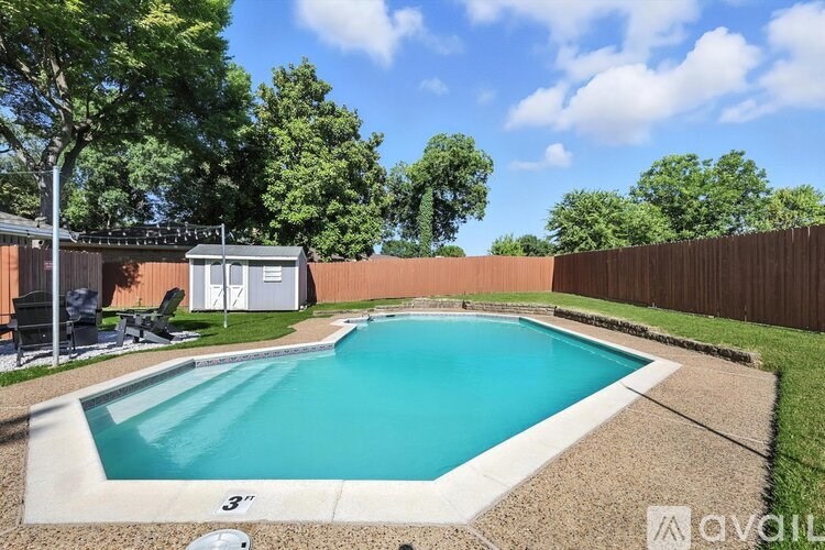 A small rectangular pool surrounded by a concrete border.