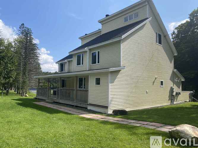 A house with a porch and a balcony is for sale.