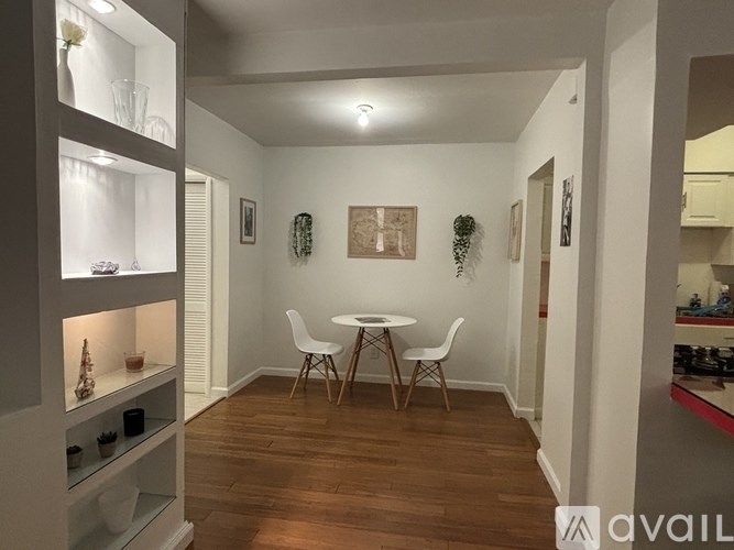 A small, well-lit dining area with a table and chairs.