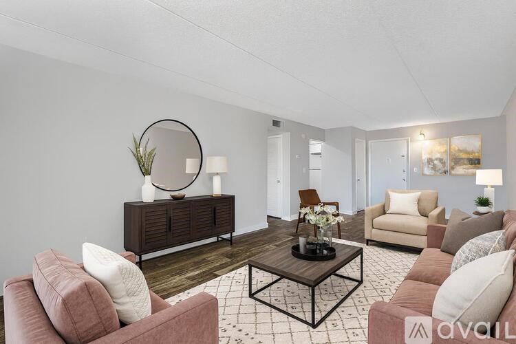 A bathroom with a toilet, sink, and bathtub.