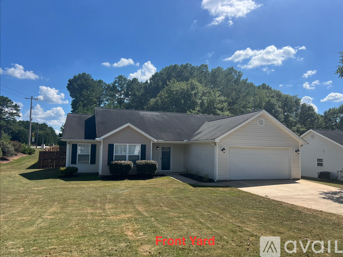 A house with a garage is for sale.