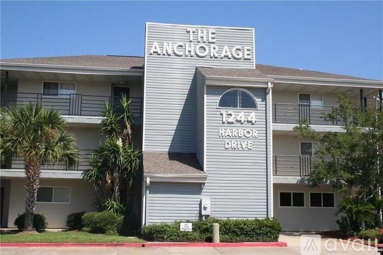 The Anchorage is a grey building with a sign on the front.