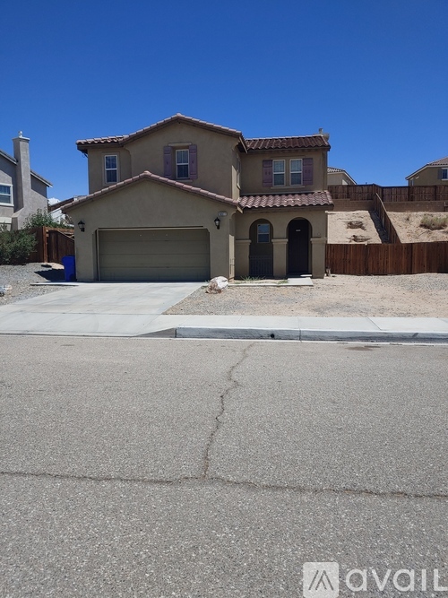 A house with a garage is available for sale.