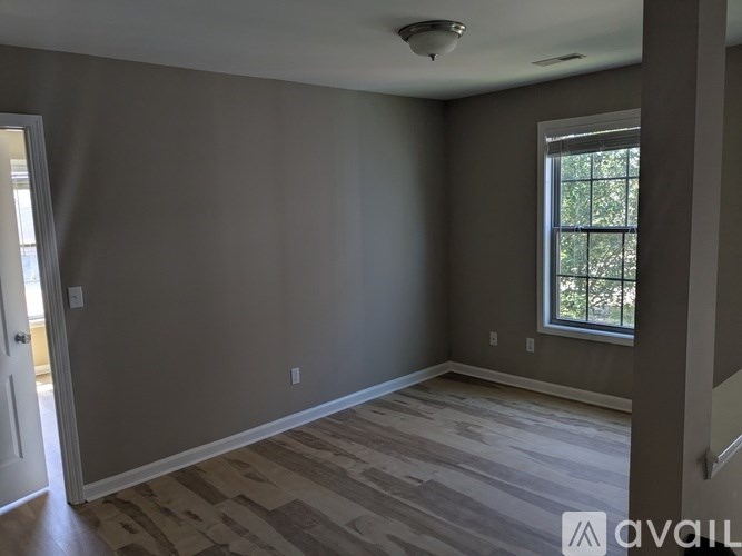 A room with a window and a door.