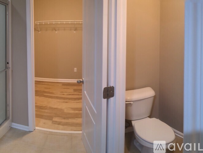 A bathroom with a toilet and a walk-in shower.