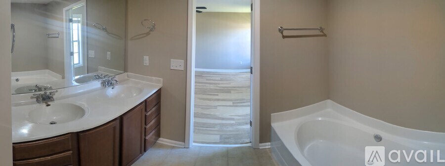 A bathroom with a tub and sink.