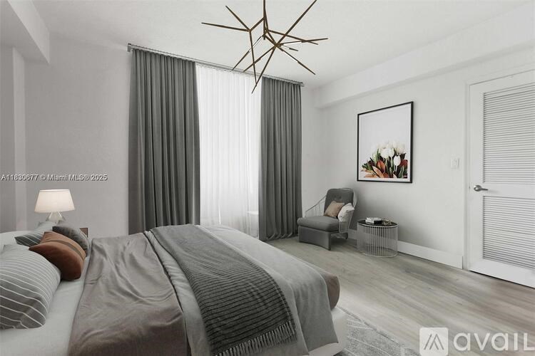 A bedroom with a large bed and a painting on the wall.