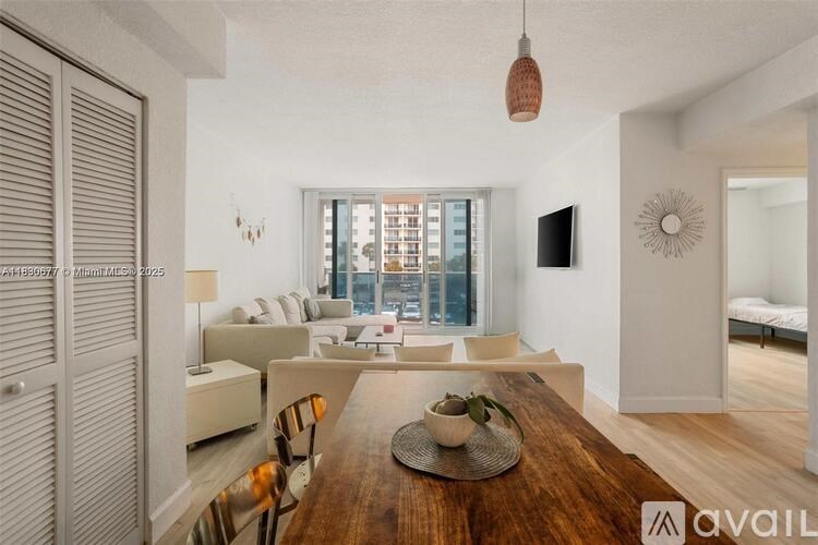 A modern dining room with a wooden table and chairs.