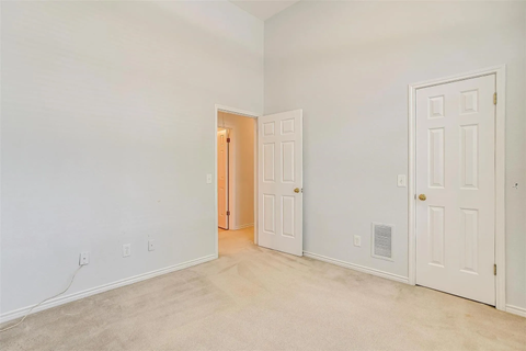 A white door is on the right side of a room.