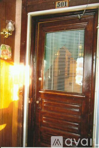 A wooden door with a number 501 above it.