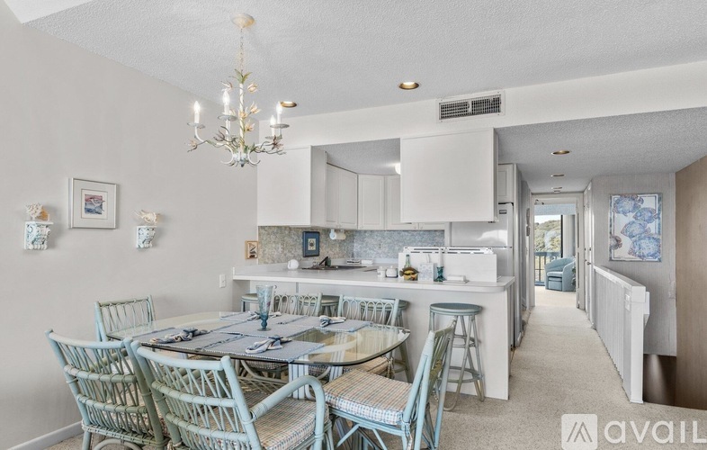 A dining room with a table set for six.