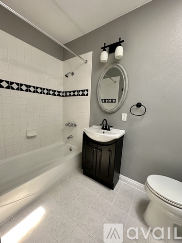 A room with grey walls and a white window.