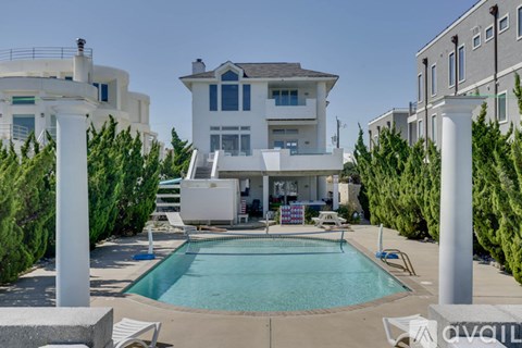 A large house with a pool in the backyard.