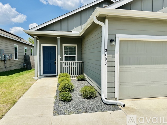 A house with the number 2408 on the garage door.