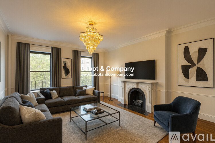 A room with wooden floors and a fireplace is available for rent.