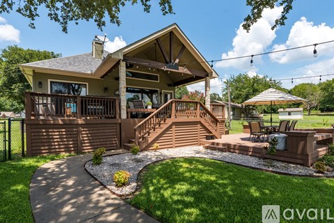 A house with a porch and a small garden.
