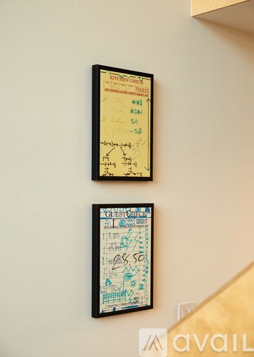 Two posters on a wall with the word "available" in the bottom right corner.