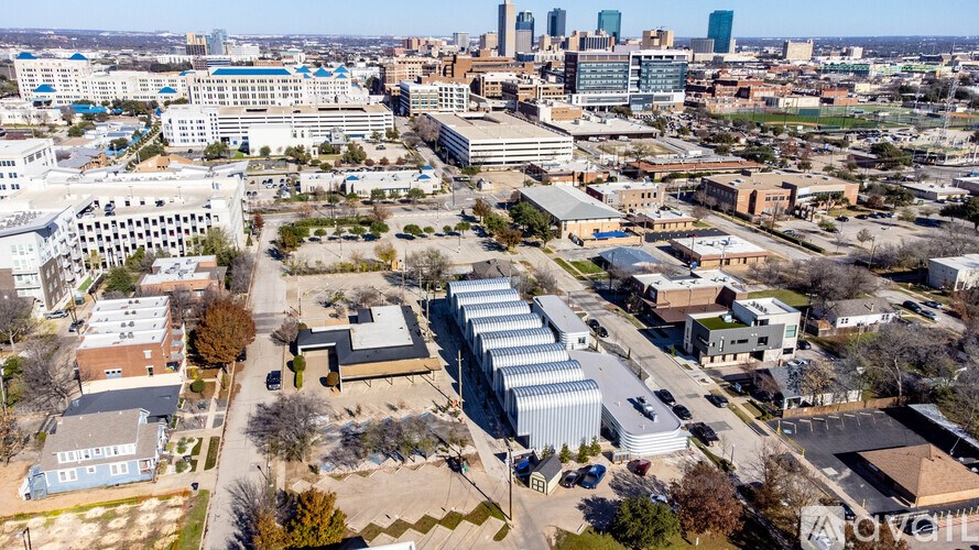 A cityscape with buildings and a clear sky.