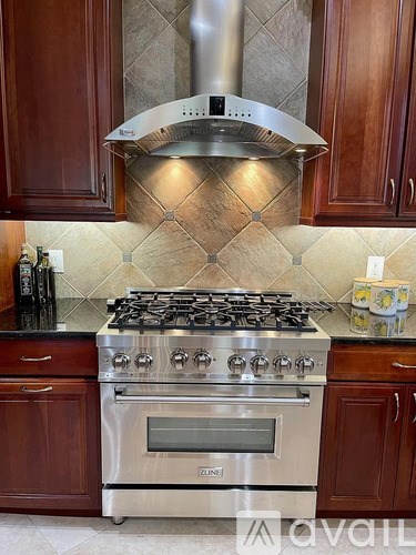 A kitchen with a stove and oven.