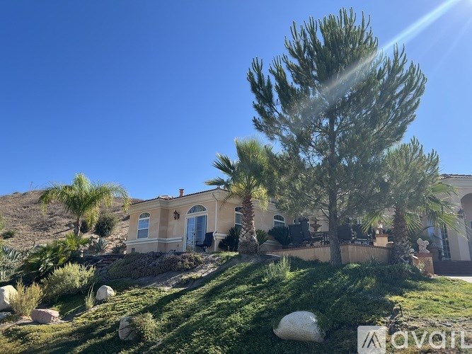 A house with a blue sky in the background.