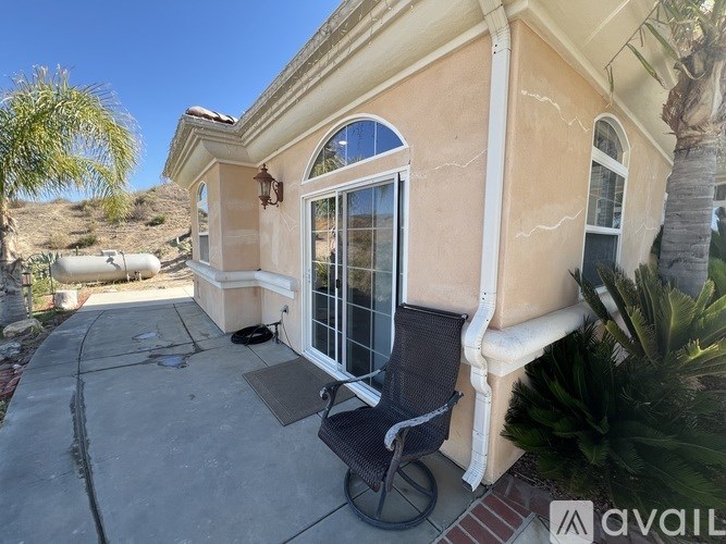 A house with a patio and a chair.