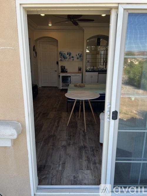 A view into a kitchen from a doorway.