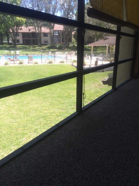 A view of a pool through a window.