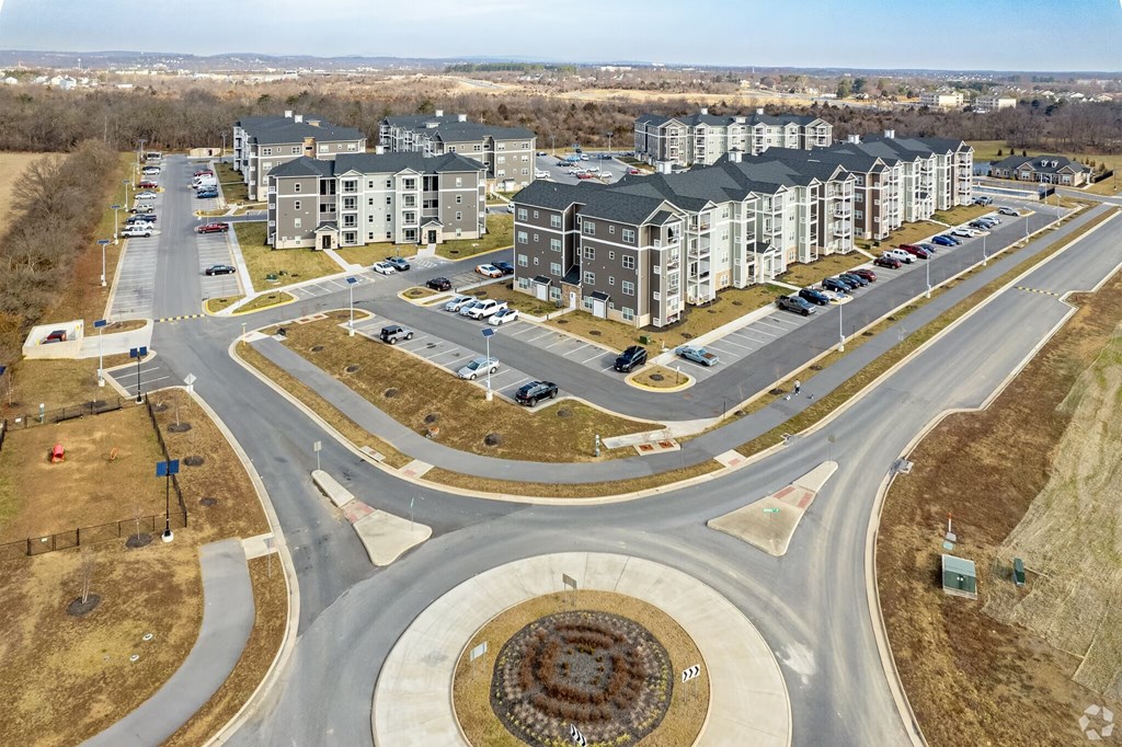 A roundabout with a building in the background.