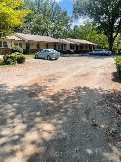 A car is parked in front of a house.