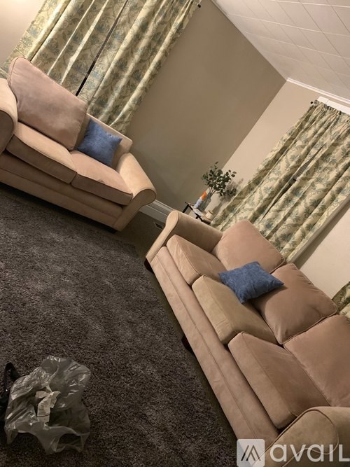 A living room with a couch and a chair.