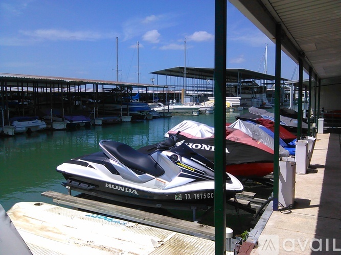 A Honda jet ski is parked at a dock.