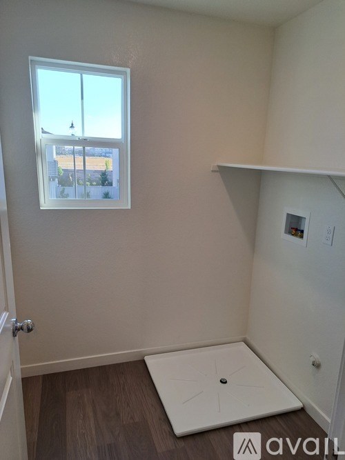 A room with a window and a door.