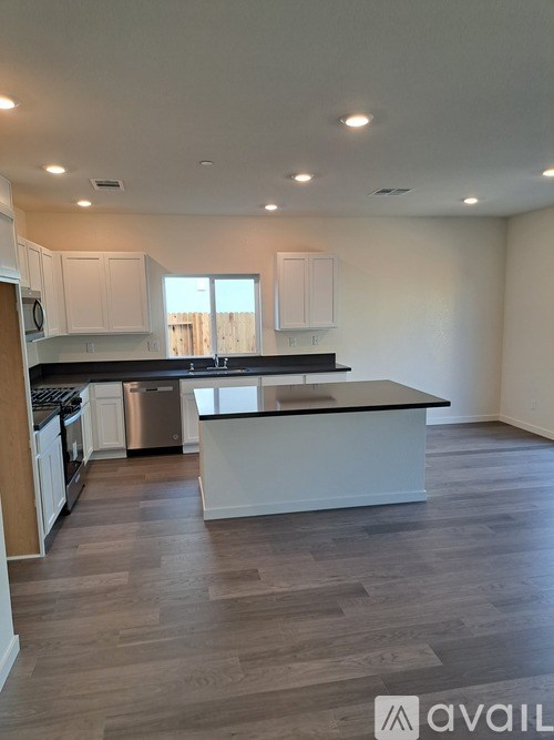 A kitchen with a large island in the middle.