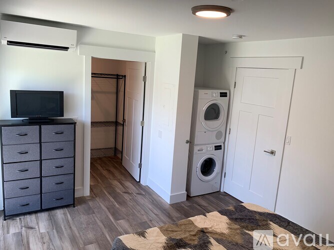 A room with a washer and dryer in it.