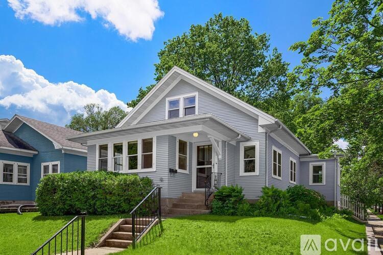 A house with a front porch and a small front yard.