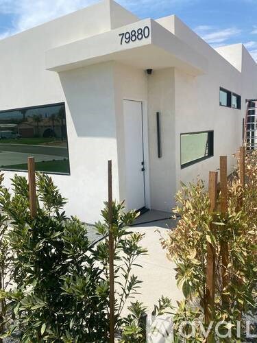 A white house with the number 79880 on the top.