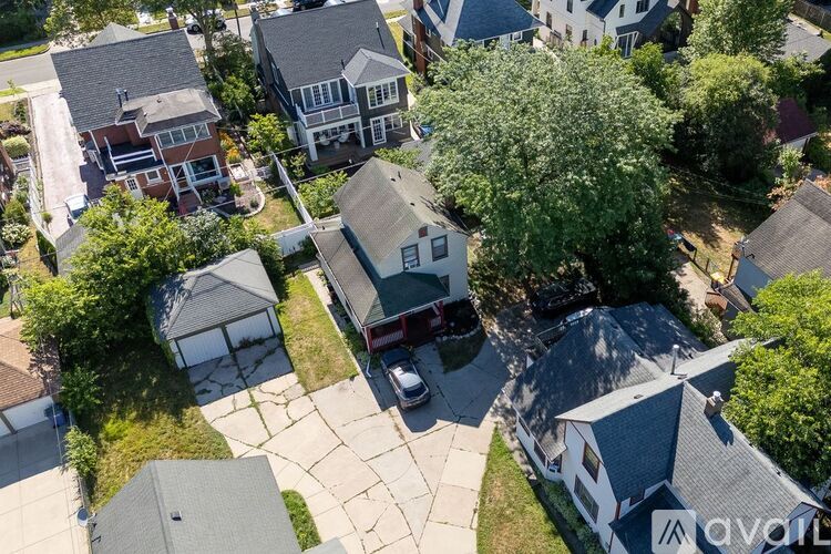 A bird's eye view of a residential area with houses and trees.
