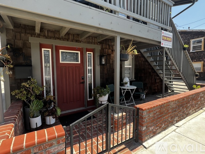 A house with a red door is for sale.