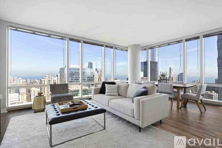 A living room with a view of the city skyline.