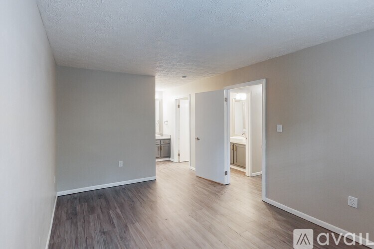 A room with a doorway leading to another room.