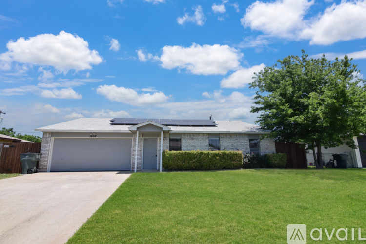 A house with a garage and a driveway is for sale.